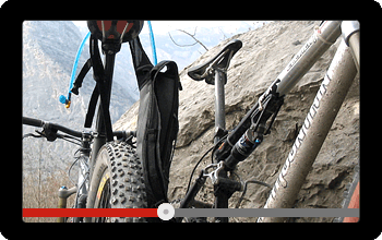 Screen showing a video of a mountain bike tour